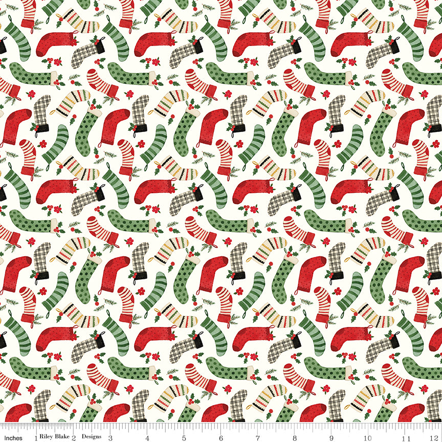 Pattern of red and green Christmas stockings on a white background