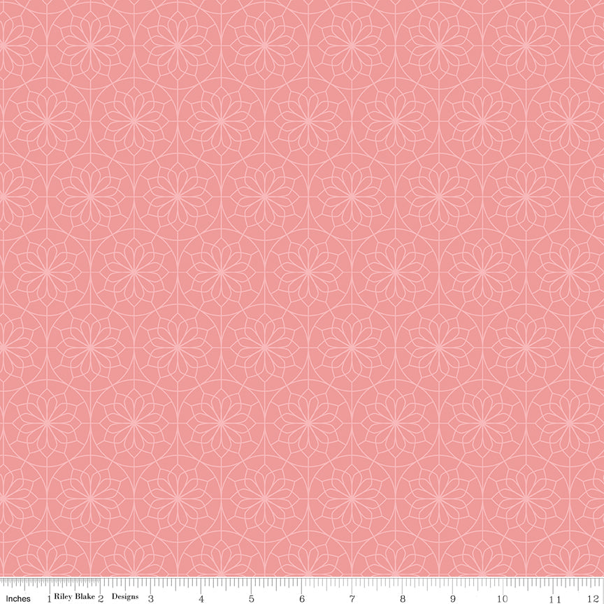 Patterned fabric with geometric design on a pink background
