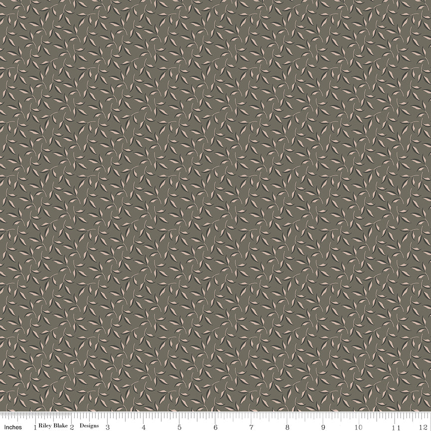 Patterned fabric swatch with small, intricate design on a light gray background