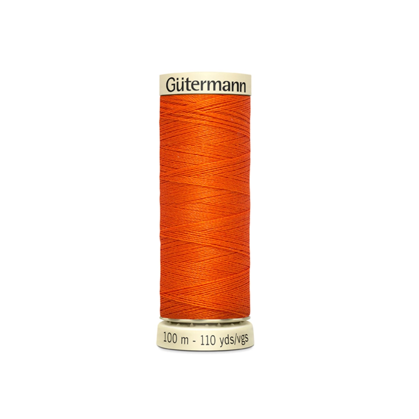 Orange spool of Gutermann thread on a white background