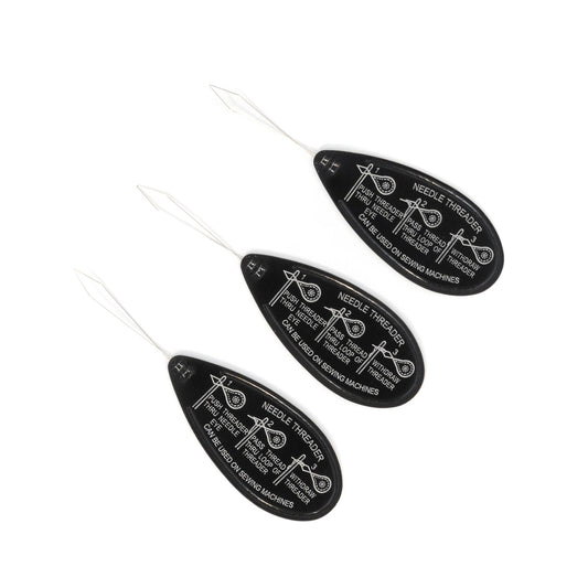 Set of three needle threaders with black labels on a white background