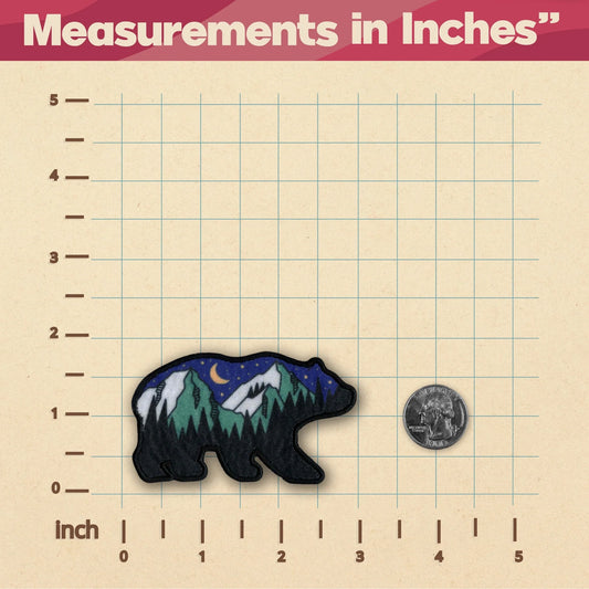 Bear patch with nature design on a grid background with measurements in inches