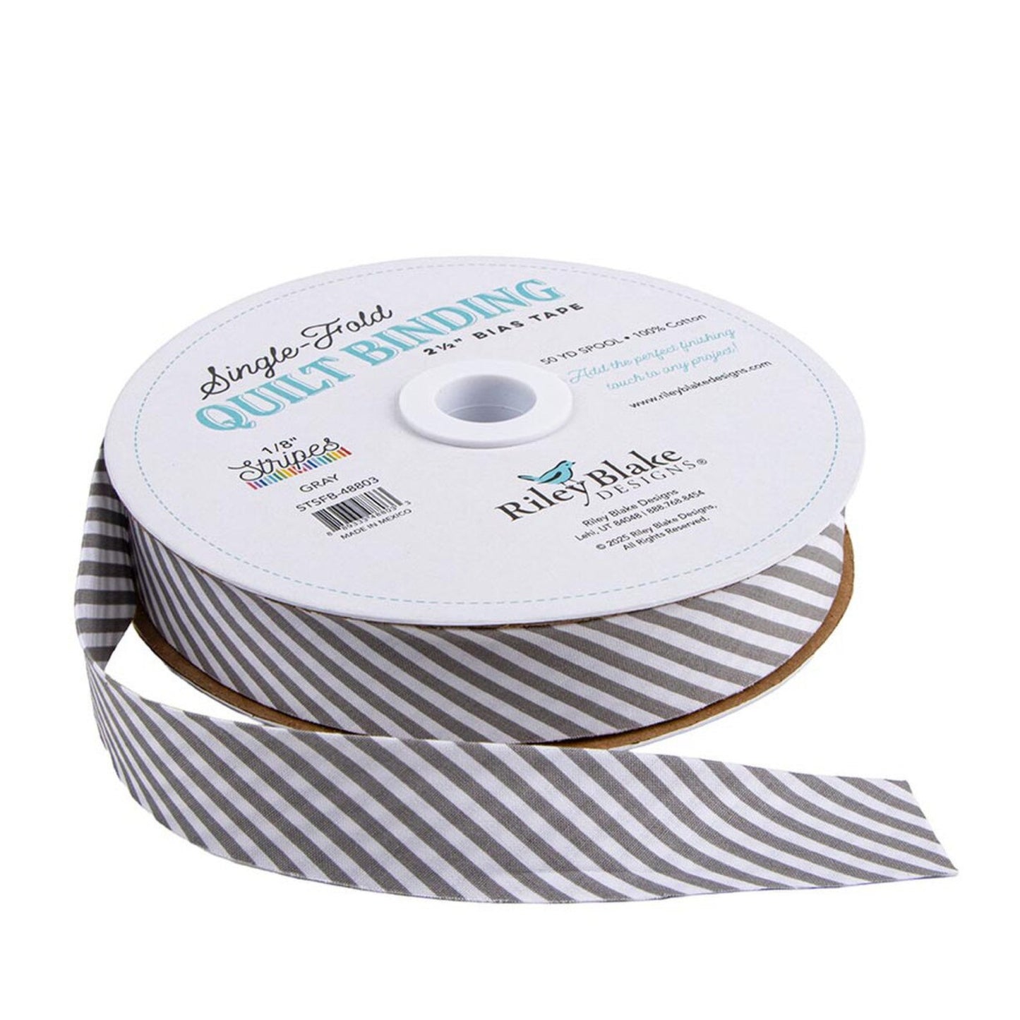 A spool of Riley Blake Crafts single fold quilt binding grosgrain ribbon, featuring a gray and white striped pattern, with the brand name and product details printed on the white spool label.