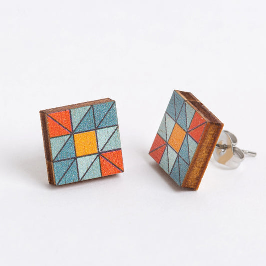 Geometric patterned square earrings on a white background
