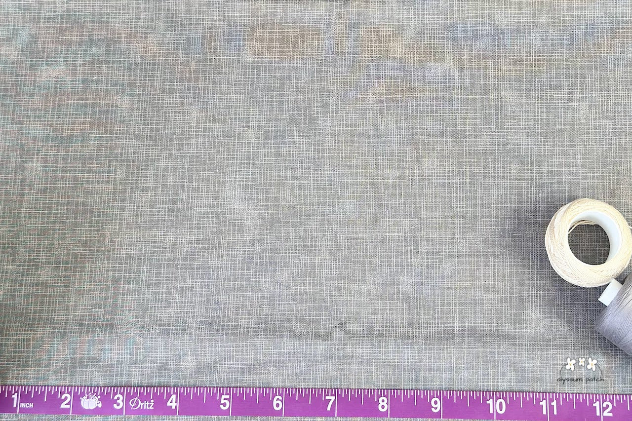 Close up of Quilters Linen Stone to show scale of print