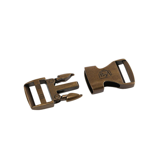 Two bronze belt buckle pieces on a white background