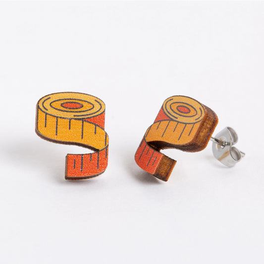 Wooden tape measure earrings on a white background