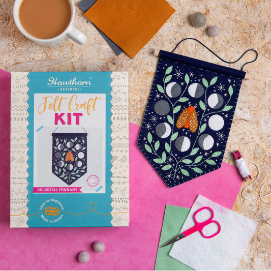 Celestial Pennnant Felt Craft Kit completed next to packaging
