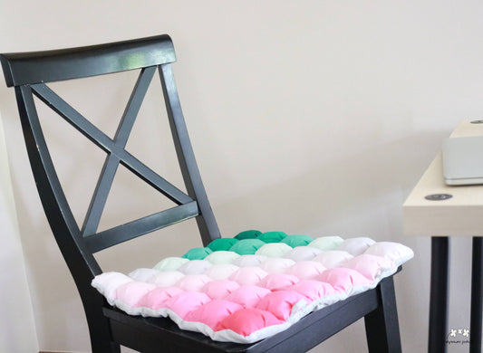 Melon Seat Cushion in use on a hard chair