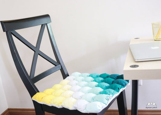 Seaside Seat Cushion in use on a hard chair