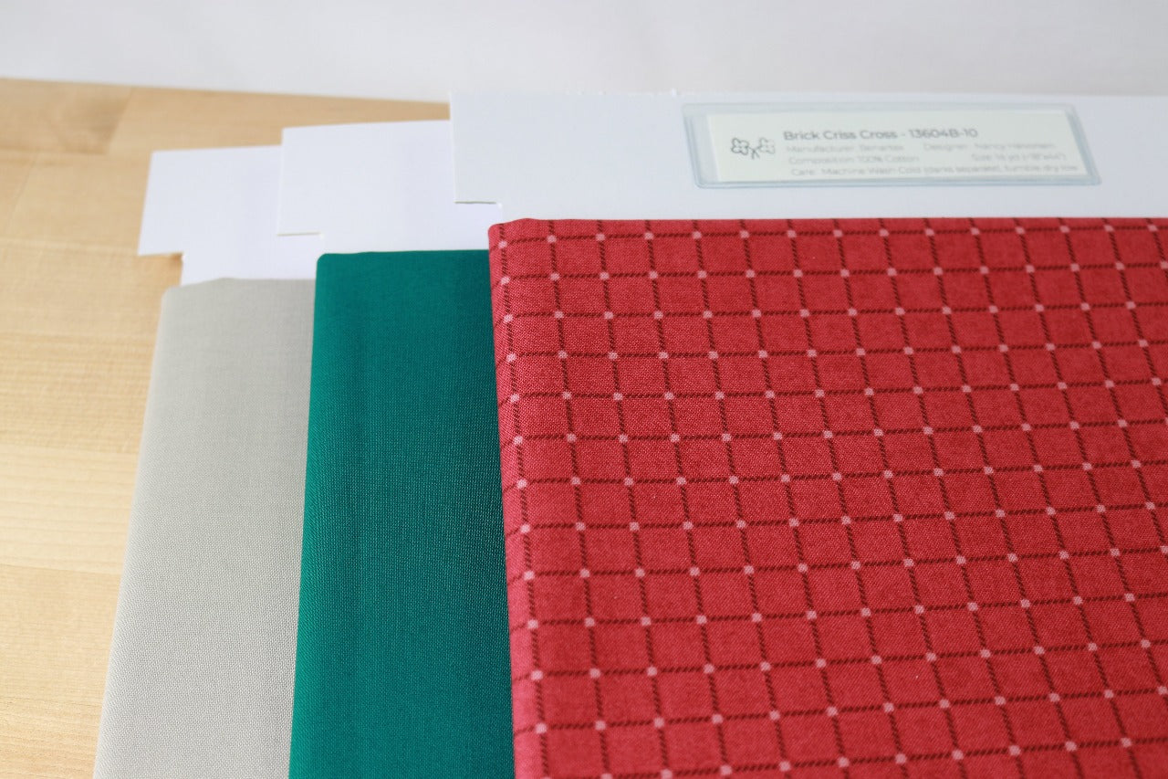 Precut Brick Criss Cross fabric paired with Kona Solids Everglade and Kona Solids Ash