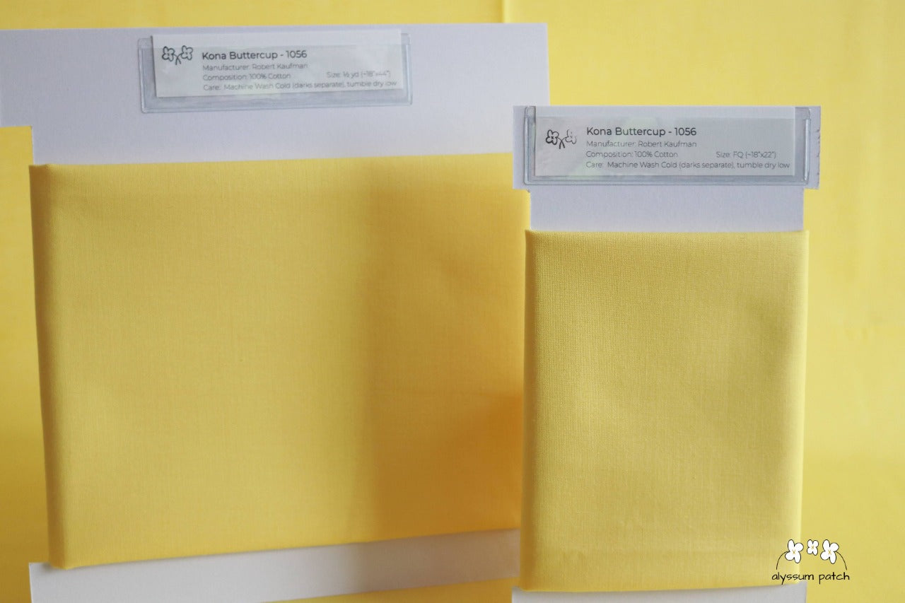 Kona Solids Buttercup precut fat quarter and half yard fabric wrapped on fabric winders