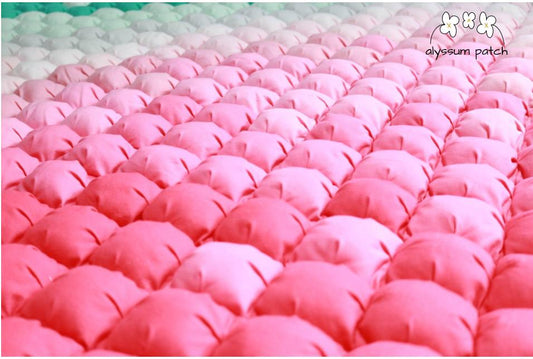 Close up of Melon Patchwork Puff Quilt