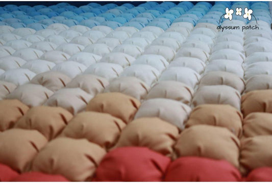 Close up view of Sandalwood Patchwork Puff Quilt