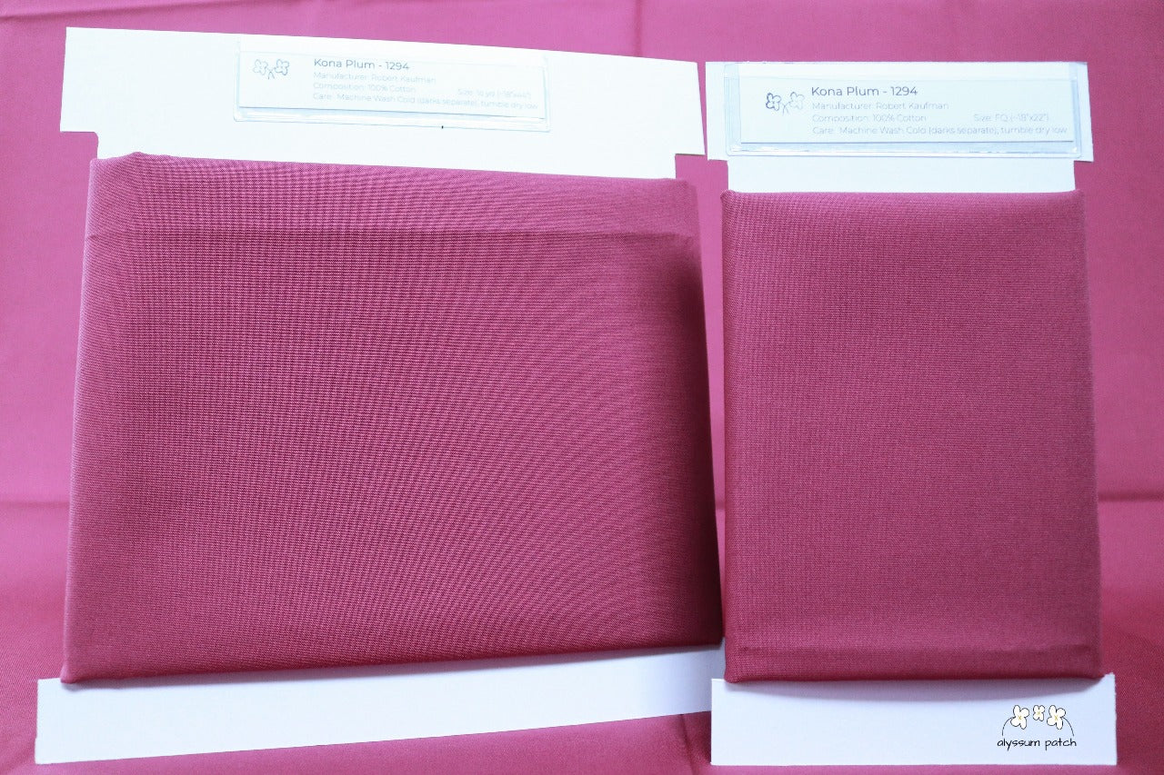 Kona Solids Plum precut fat quarter and half yard fabric wrapped on fabric winders