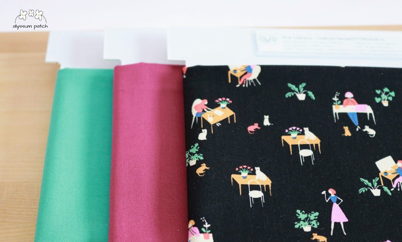 At the Library precut fabric paired with Kona Solids Plum and Kona Solids Candy Green
