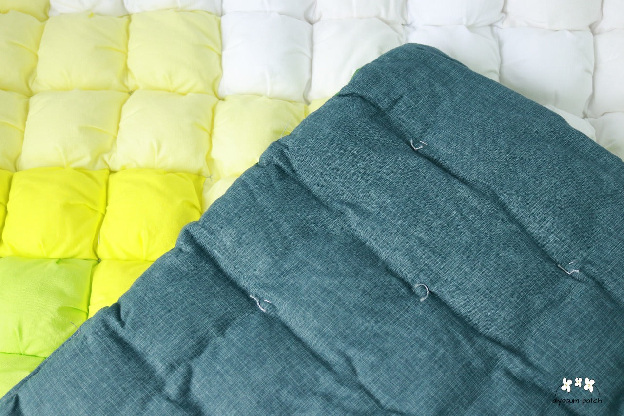 Back of Citron Patchwork Puff Quilt