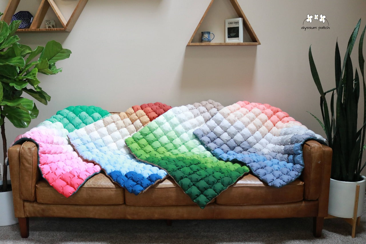 Collection of Patchwork Puff Playmats showing style variations