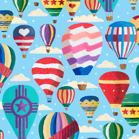 A repeating pattern of colorful hot air balloons floating in a light blue sky with small white clouds. The balloons feature various designs including stripes, hearts, stars, and geometric patterns in red, white, blue, green, yellow, and purple.