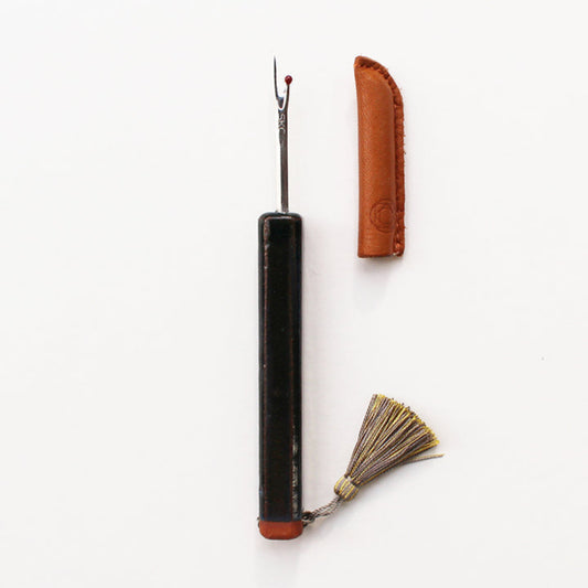 Gray Seam Ripper with leather case on a white background