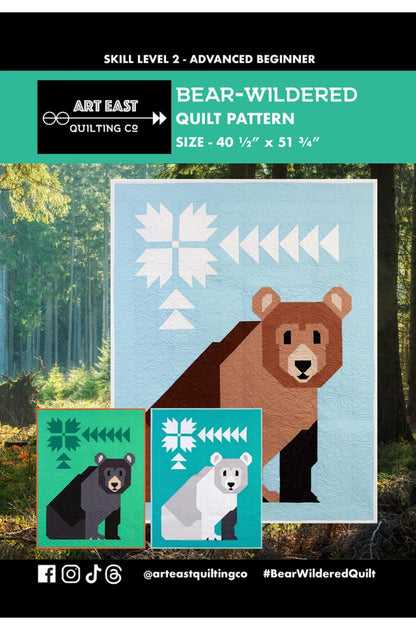 Quilt pattern for 'Bear-Wildered' with a bear design on a blue background, surrounded by trees.