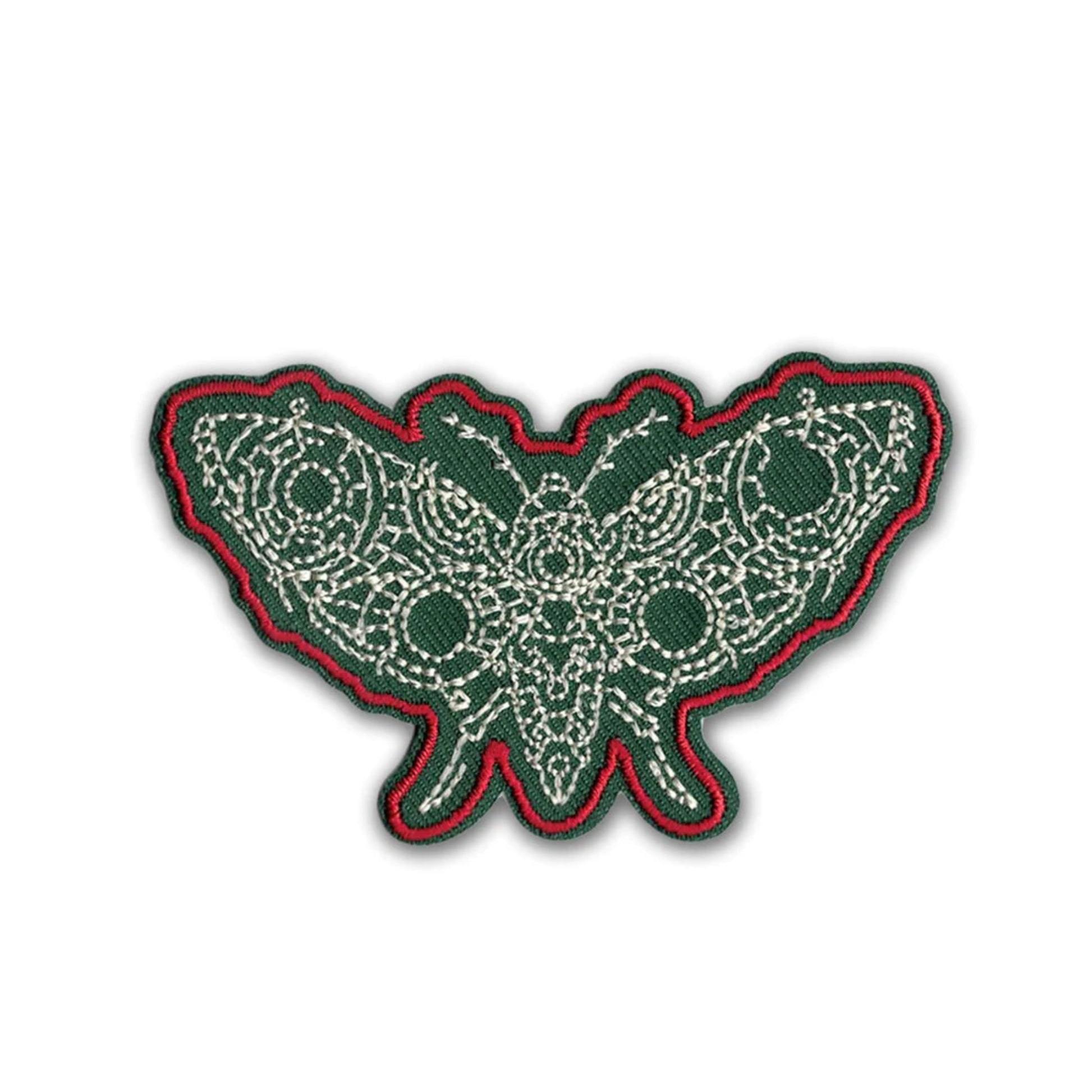 Decorative patch with green and red border on a white background