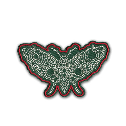 Decorative patch with green and red border on a white background