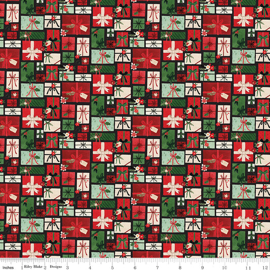 Pattern of Christmas presents in red, green, and white on a fabric swatch.
