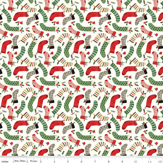 Pattern of red and green Christmas stockings on a white background