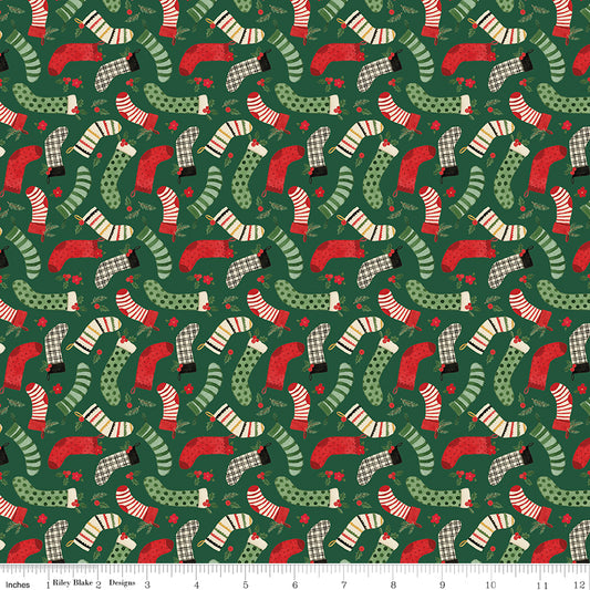 Pattern of Christmas-themed socks on a green background with a fabric swatch at the bottom.