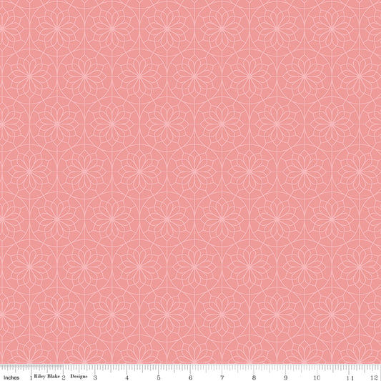 Patterned fabric with geometric design on a pink background