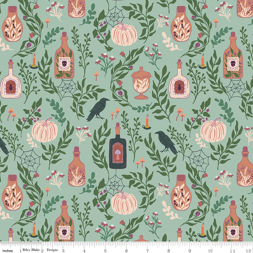 Halloween-themed fabric pattern with pumpkins, bottles, and leaves on a teal background.