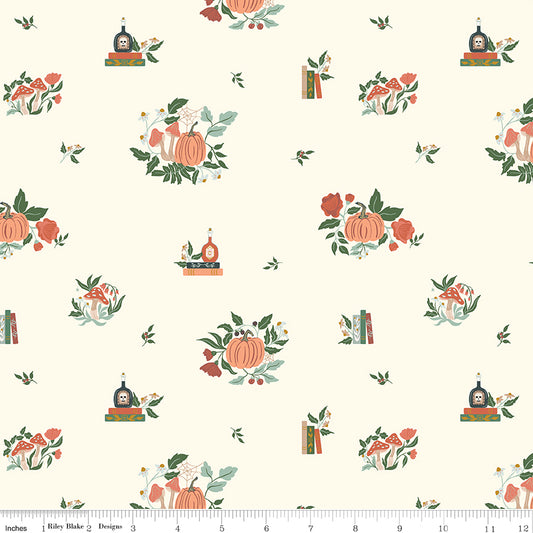 Patterned fabric with pumpkins, flowers, and books on a white background
