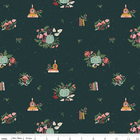 Patterned fabric with pumpkins, flowers, and bottles on a dark blue background