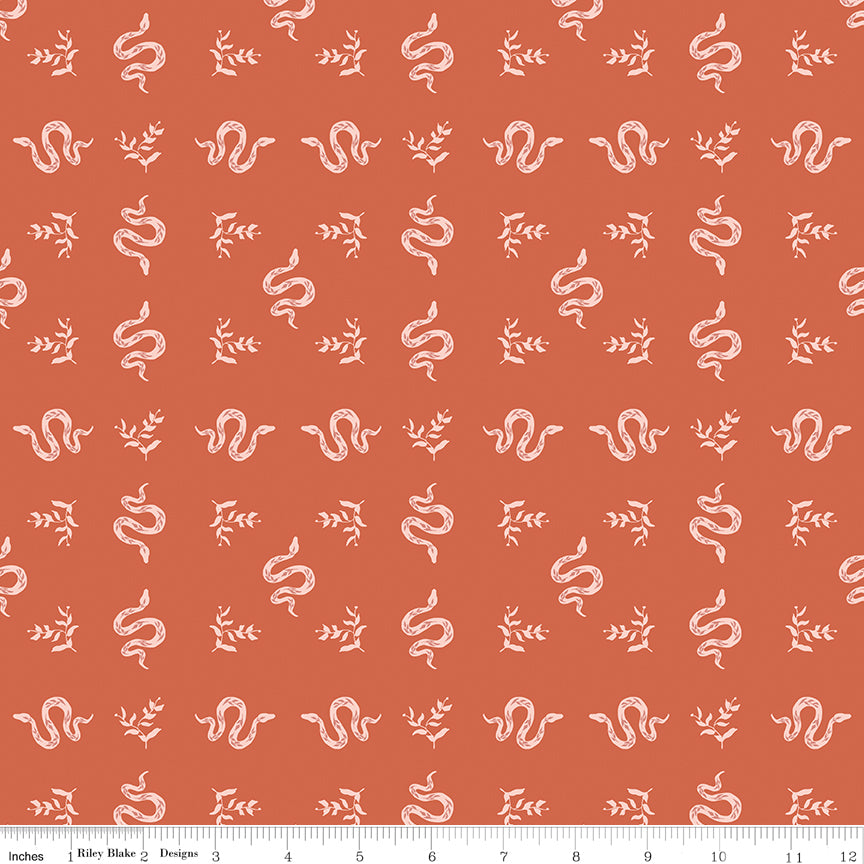 Pattern of white snakes and leaves on a red background with a ruler at the bottom.