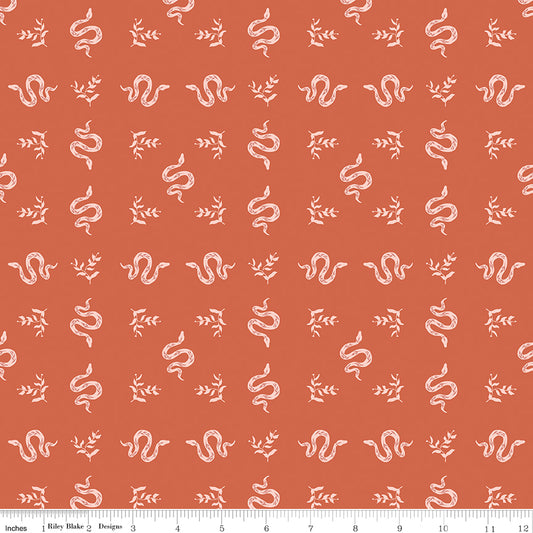 Pattern of white snakes and leaves on a red background with a ruler at the bottom.