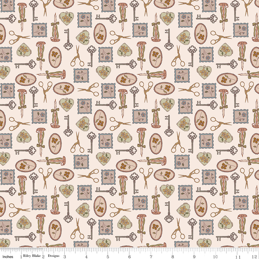 A repeating vintage-style pattern on a warm cream background featuring antique keys, scissors, hearts, and postage-style stamps in muted brown, dusty blue, sage green, and soft pink. A fabric ruler along the bottom edge shows the print scale.