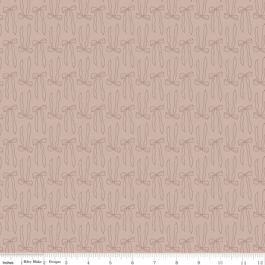 Pink fabric with small outlined bows pattern