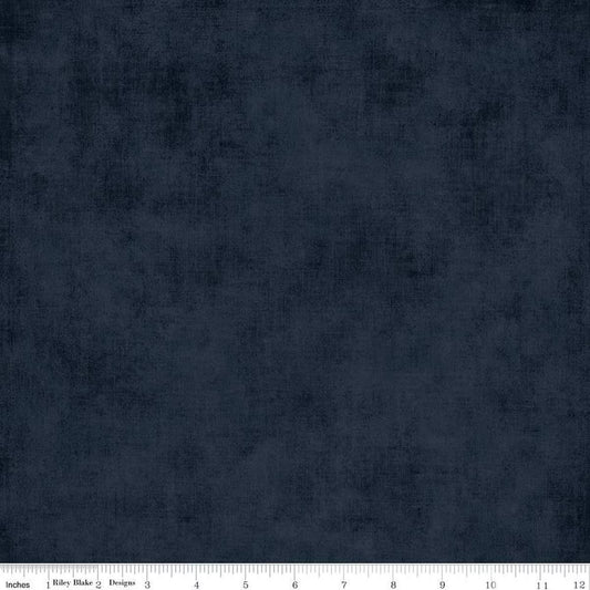 Navy blue fabric texture with a ruler at the bottom for scale.
