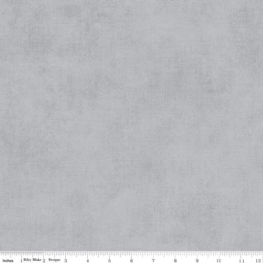 Solid gray fabric texture with a ruler at the bottom for scale.