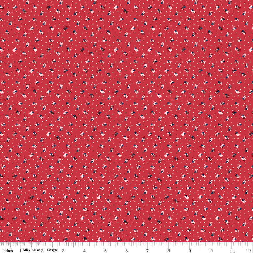 Red fabric with small US Flag pattern, measurement scale at the bottom