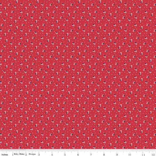 Red fabric with small US Flag pattern, measurement scale at the bottom