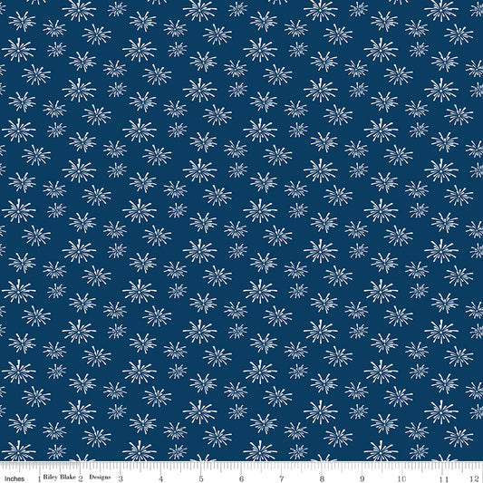 Blue fabric with white firework pattern, featuring a ruler at the bottom for scale