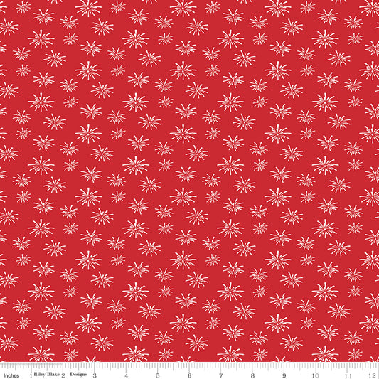 Red fabric with white firework pattern and ruler at the bottom