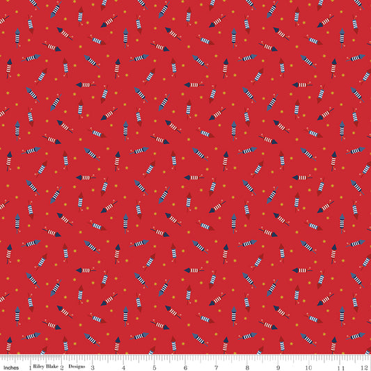 Pattern of colorful firecrackers on a red background with a ruler at the bottom.