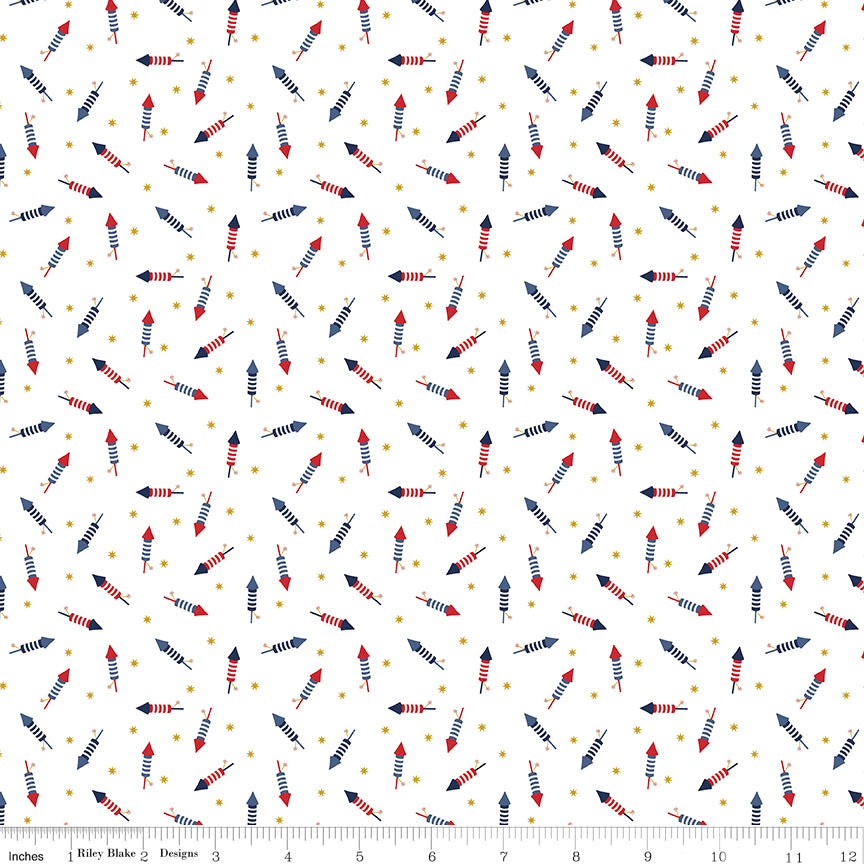 Patterned fabric with small arrows and dots on a white background, featuring a ruler for scale.