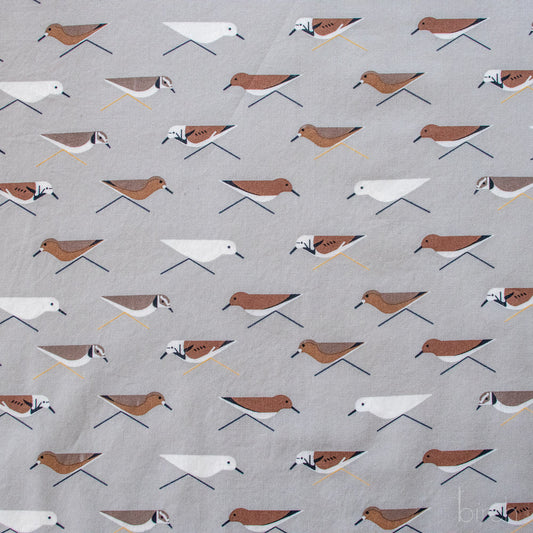 Pattern of small birds on a gray background