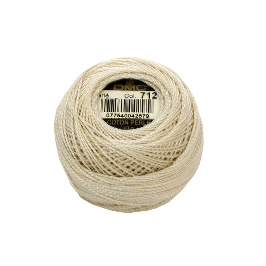 Ball of beige thread with a label on a white background