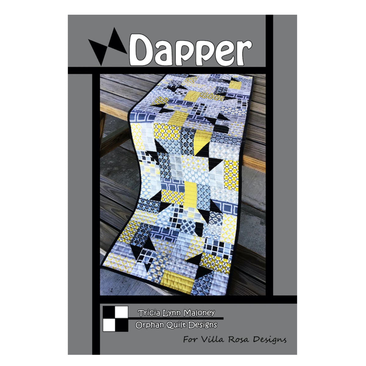 A quilt pattern cover titled 'Dapper' by Tricia Lynn Maleney from Orphan Quilt Designs, for Villa Rosa Designs. The cover features a photo of a geometric patchwork table runner in yellow, gray, black, and white, draped over a wooden table.