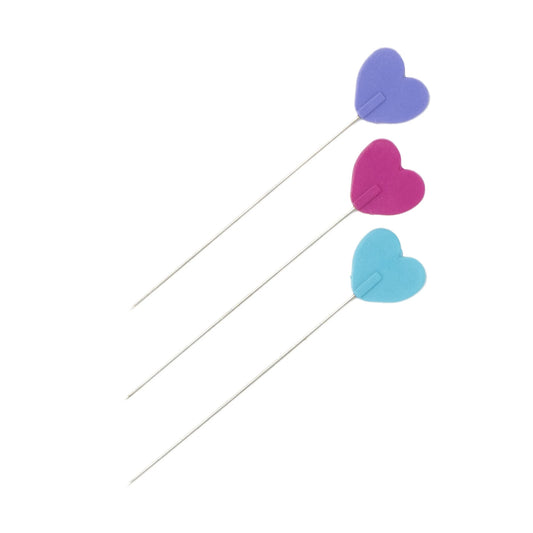 Three heart-shaped clips in purple, pink, and blue on a white background